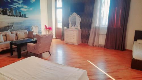 a living room with a couch and a dresser at Campus Luxe Castle Hotel in Yerevan