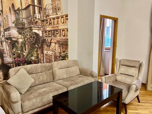a living room with a couch and a coffee table at Campus Luxe Castle Hotel in Yerevan