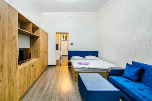 Llit o llits en una habitació de MERCHANT Apartment