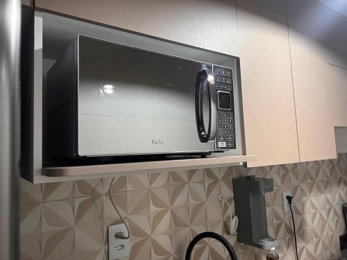 Et badeværelse på Apartamento aconchegante.