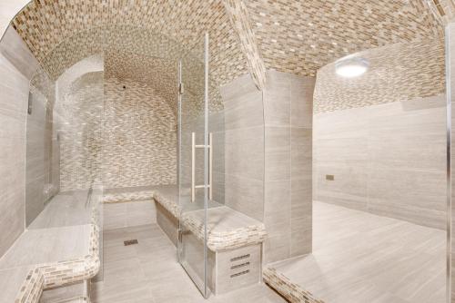 a bathroom with a shower in a brick wall at Blueground Fitzrovia spa nr Oxford St LON-178 in London