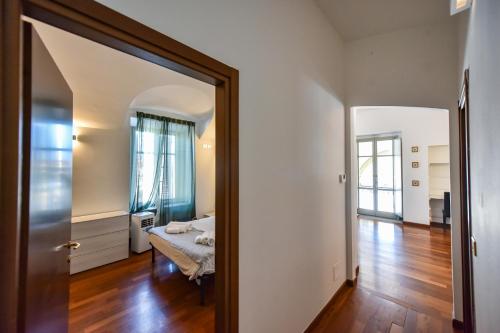 a bedroom with a mirror and a bed in a room at Portico Juvarra in Turin