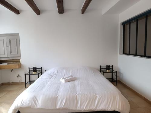 Ένα ή περισσότερα κρεβάτια σε δωμάτιο στο L'appartement du Golf