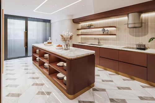 a large kitchen with a large island in the middle at Grand Mays Inn Hotel & Spa in Ho Chi Minh City