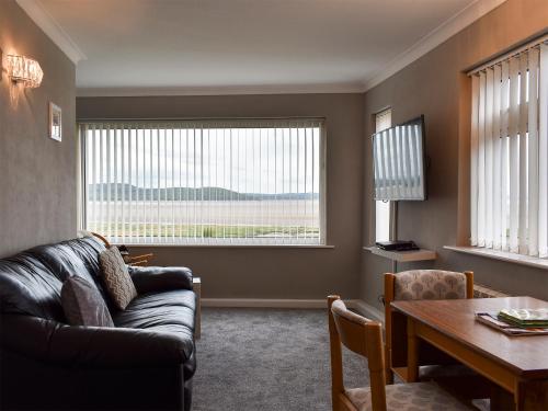 Posezení v ubytování Dolphin Cottage