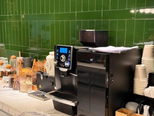 a kitchen with a coffee making machine on a counter at Atour Hotel ShanghaiPeople's Square Xintiandisubway - FreeMini Bar and Free NightSnacks in Shanghai