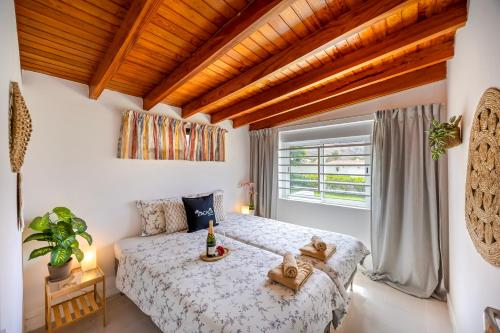 a bedroom with a bed and a window at 3BR Tauro Bungalow - Garden, Terrace, Sleeps 6 in Mogán