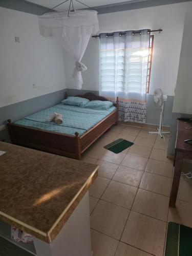 Postel nebo postele na pokoji v ubytování Diani Cozy Garden Studio