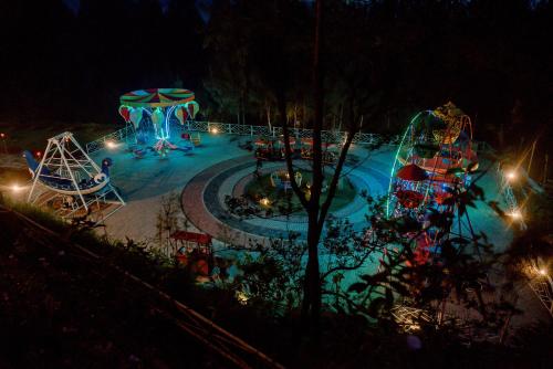 a water park at night with a roller coaster at Plataran Bromo in Bromo