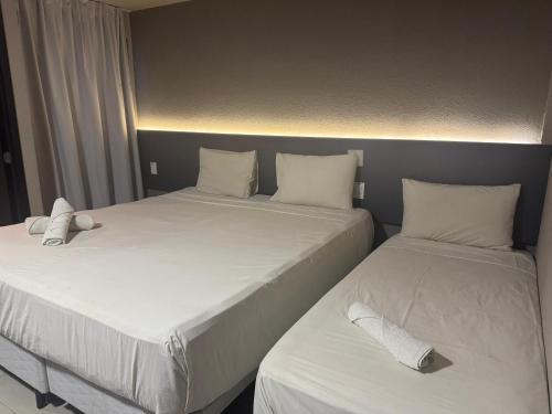 Ένα ή περισσότερα κρεβάτια σε δωμάτιο στο Saint Patrick Grand Hotel