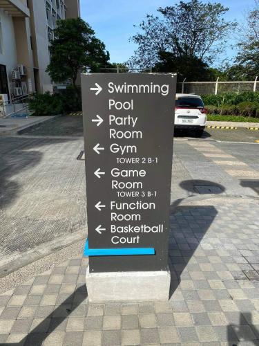 a sign on the side of a street at Laidback Cavern at Studio City Alabang in Manila