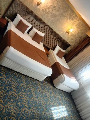 two beds sitting on top of a room at TAC MAHAL HOTEL in Ankara