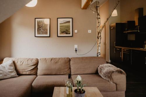 a living room with a couch and a table at Kirnermarteshof in Oberried
