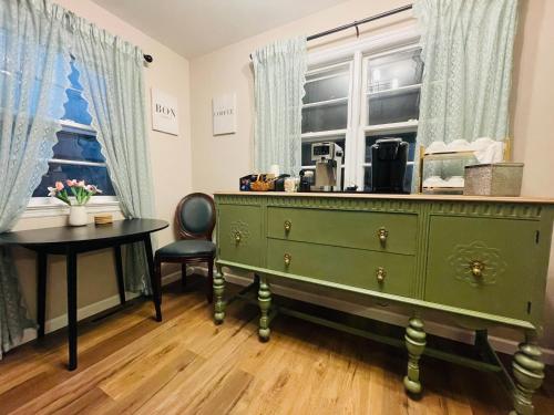 a green dresser in a room with a table and a window at Private Estate, Walk to Princeton Downtown, 3-Bedrooms 2-Bath with Free Parking in Princeton