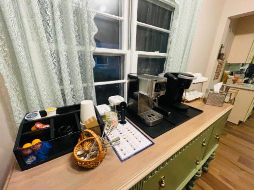 a kitchen counter with a coffee maker and a window at Private Estate, Walk to Princeton Downtown, 3-Bedrooms 2-Bath with Free Parking in Princeton