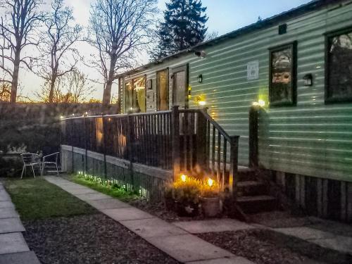 a house with a porch with lights on it at The Hive in Hawick