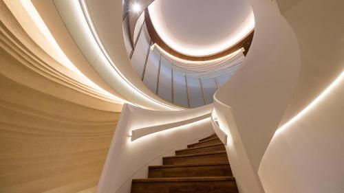 a spiral staircase in a building with a ceiling at InterContinental Yokohama Pier 8 by IHG in Yokohama