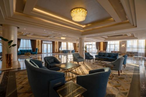 a lobby with couches and chairs and a table at Seven Seas Jolie Bay - Ultra All Inclusive in Hurghada