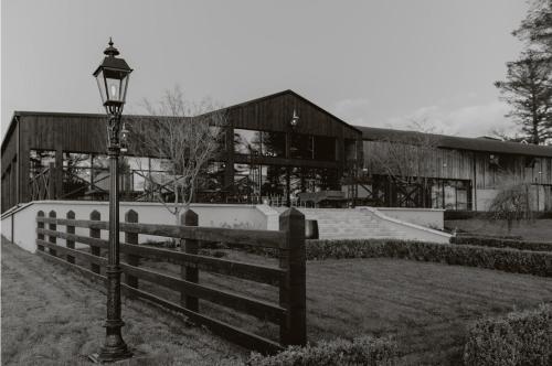 a black and white photo of a building with a street light at The Penthouse in Dungiven