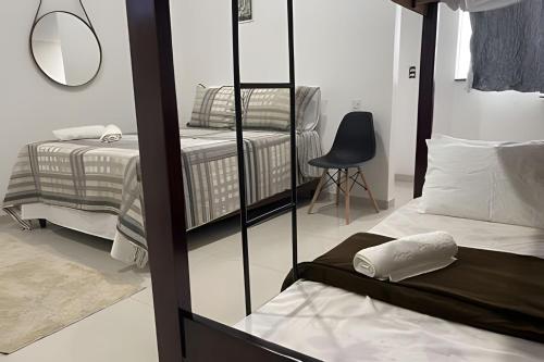 Katil atau katil-katil dalam bilik di Apartamentos Vitória