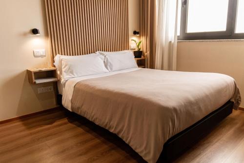 Ένα ή περισσότερα κρεβάτια σε δωμάτιο στο room Select Porto