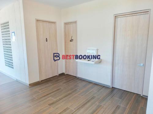 a room with three doors and a sign that reads bestboxing at Santa Marina Luxury Stay - Ocean View in Estación El Salto