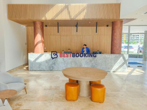 a man taking a picture of a desk in a lobby at Santa Marina Luxury Stay - Ocean View in Estación El Salto
