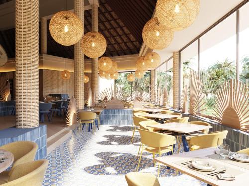 a restaurant with tables and chairs and chandeliers at Bahia Principe Grand Tequila - Adults Only All Inclusive - New Opening Dec 2025 in Akumal