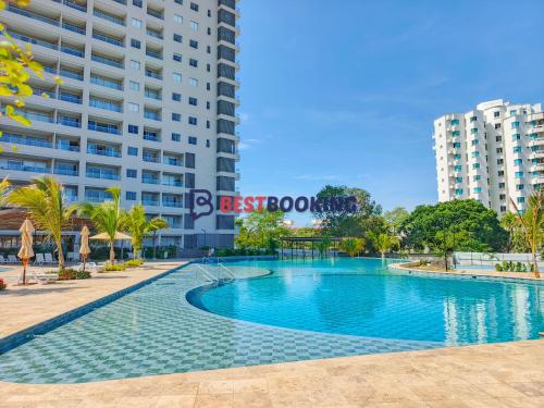 a swimming pool in front of a building at Santa Marina Luxury Stay - Ocean View in Estación El Salto