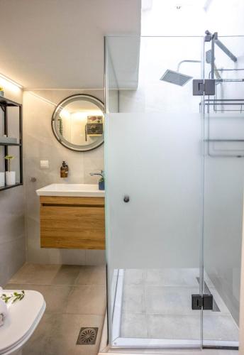 a bathroom with a shower and a sink at LITSA in Iraklitsa