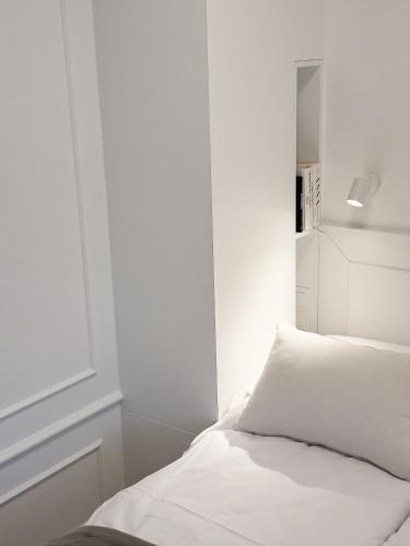 Postel nebo postele na pokoji v ubytování Skład Koncept Apartament77