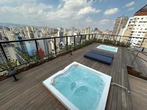 a hot tub on the deck of a building at TrevizZo Is Consolação in Sao Paulo