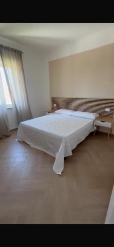 Ένα ή περισσότερα κρεβάτια σε δωμάτιο στο Casa vacanze Frem