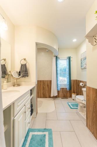 a bathroom with a sink and a toilet at White Fern in New Waterford