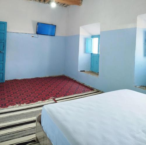 Postel nebo postele na pokoji v ubytování Tagmat guest house