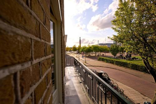 a window of a building with a view of a street at Olympic's Little Palace in Amsterdam