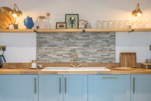 Kuchyň nebo kuchyňský kout v ubytování Penbryn-Bach