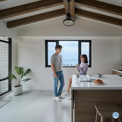 a man and a woman standing in a kitchen at 眺浪島民宿 in Fan-shu-liao