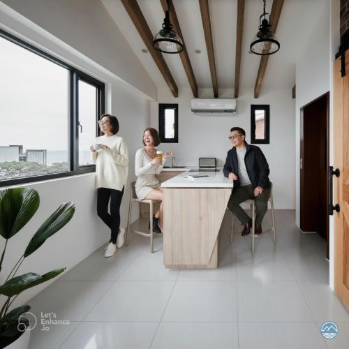 a group of people sitting at a desk in an office at 眺浪島民宿 in Fan-shu-liao