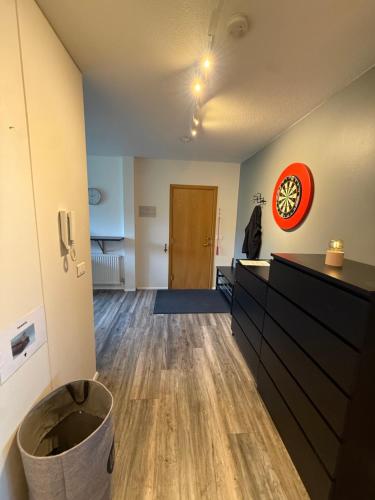 an empty room with a trash can in front of a door at Apartment in Húsavík in Húsavík