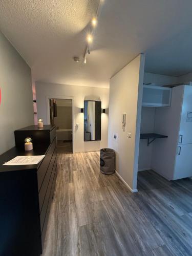 an empty living room with wood floors and a room at Apartment in Húsavík in Húsavík