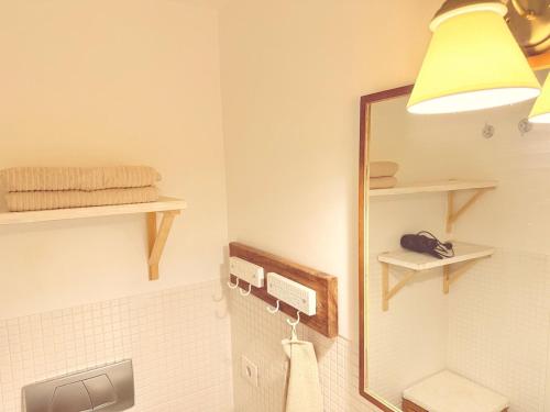 a bathroom with a mirror and a sink at Beachsuite in Poris de Abona