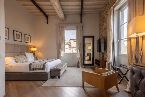 a bedroom with a bed and a large window at Donati Luxury Tower Suites in Florence