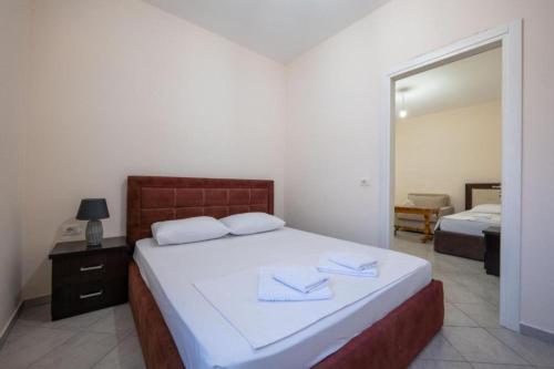 Postel nebo postele na pokoji v ubytování Taho Apartments