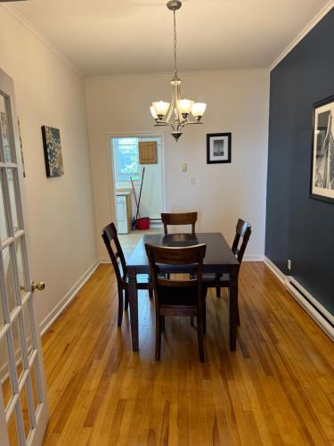a dining room with a table and chairs at Westmount Manor Unit 2 - 2 Bedroom Apartment in St. John's