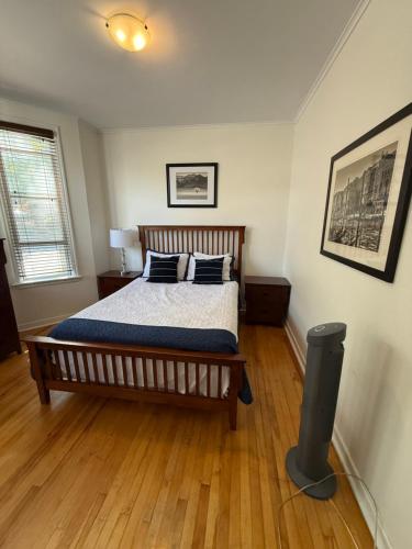 a bedroom with a bed with pillows on it at Westmount Manor Unit 2 - 2 Bedroom Apartment in St. John's