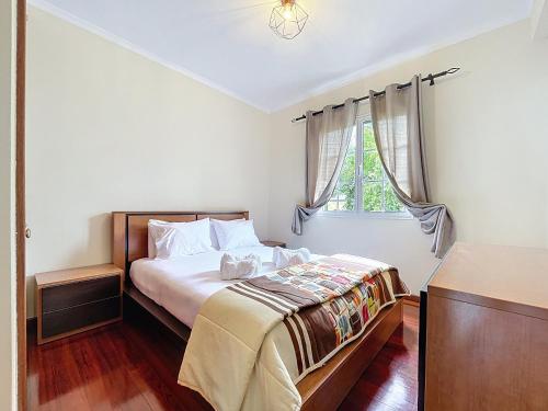 a bedroom with a bed and a window at Gaula Family Haven by Atlantic Holiday in Gaula