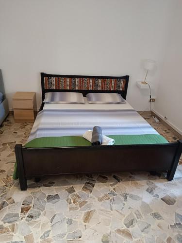 a bed with a hat on it in a bedroom at Affittacamere Pratello 97 in Bologna