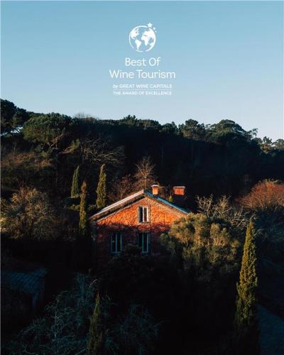 a magazine page with a picture of a house at Wine Tourism - Quinta do Ameal in Refoios do Lima
