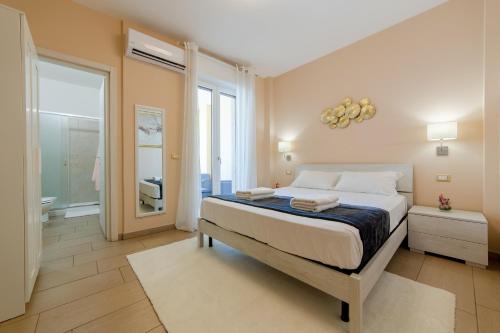 Postel nebo postele na pokoji v ubytování Affaccio Rooms